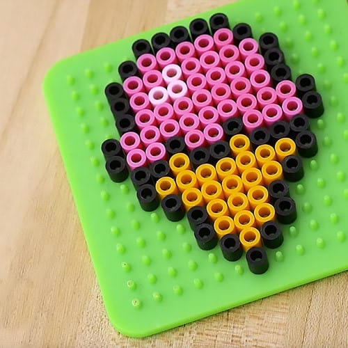 Perler beads arranged in shape of ice cream cone