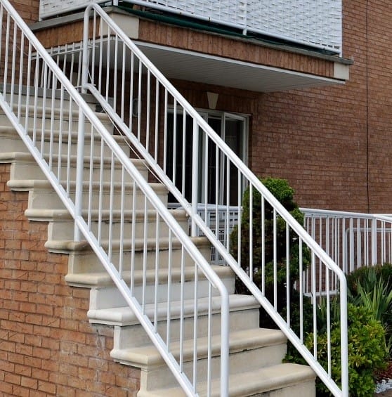 outdoor staircase with white handrails