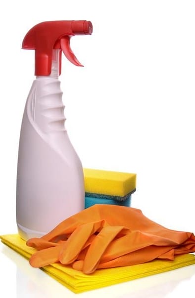 Spray bottle, sponge, and orange rubber gloves for cleaning